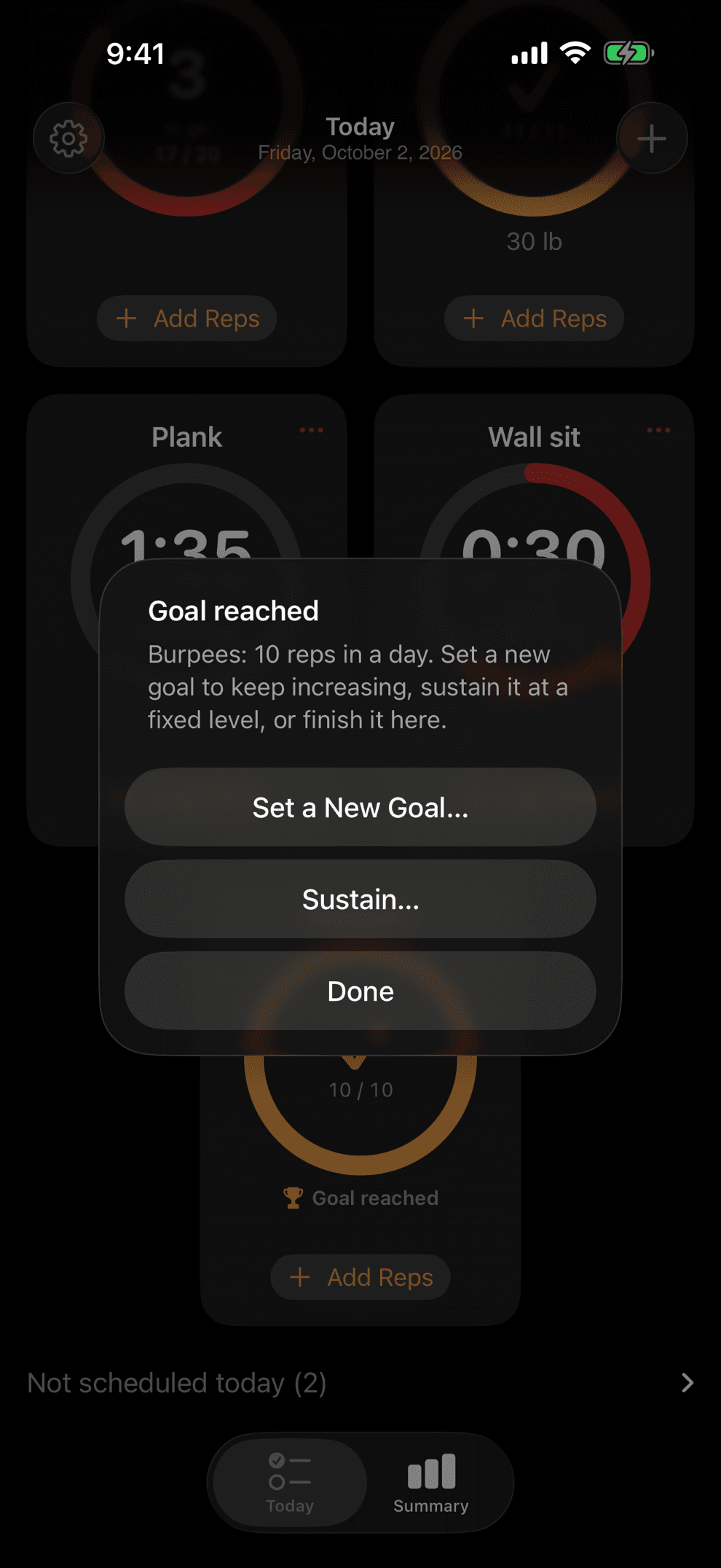 The Goal reached alert over the Today screen in dark appearance, offering Set a New Goal, Sustain and Done.